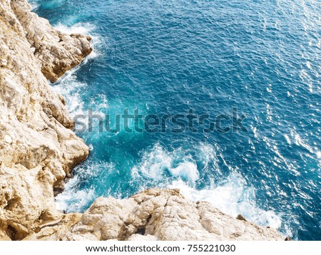 Turquoise Adriatic sea and rocky coast in dubrovnik, Croatia