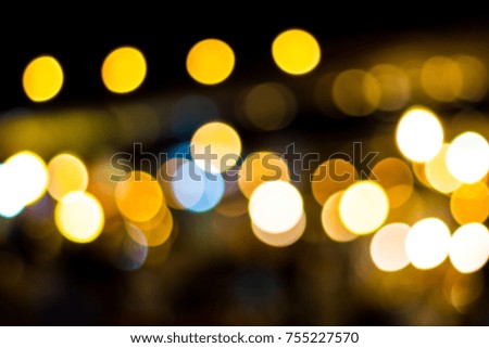 Blur - abstract background - bokeh Decorative outdoor string lights hanging in the garden at night time
