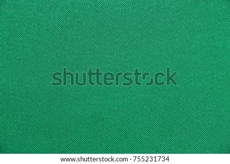 Texture of fabric green color has smooth surface, abstract background.