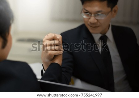 Concept: business competition, two businessmen's competitive sports arm wrestling