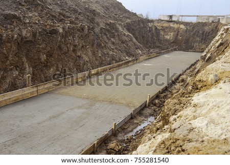 The process of building a new road, without people and construction equipment, side view
