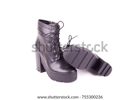 Stylish leather boots shot in studio, isolated on white.