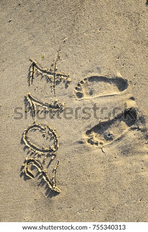 Inscription on wet sand Summer 2017. Concept photo of summer vacation.