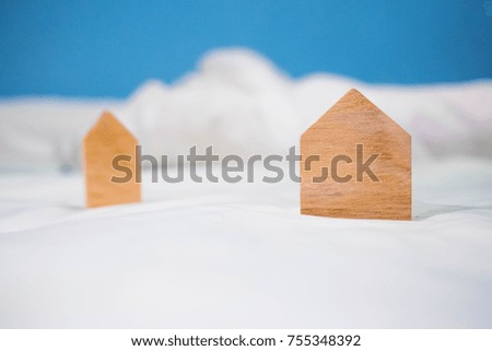 Wooden toy Miniature house on white background and blue sky