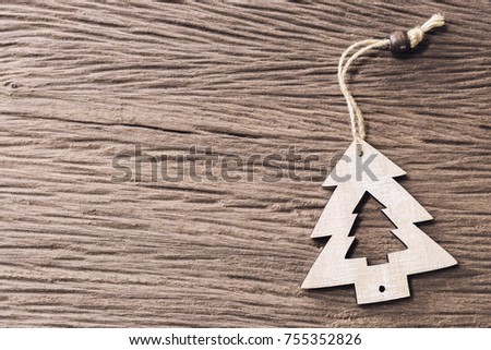 Merry Christmas concept. A Christmas tree made from wood on old wooden table texture background with free copy space. Picture for add text message. Backdrop for design art work.