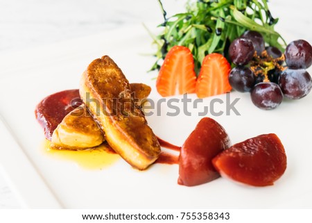 Foie gras with vegetable and fruit in white plate