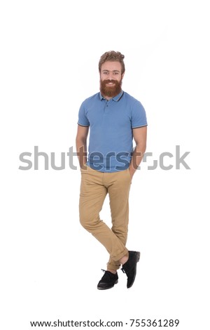 Full length shot of handsome blonde beard man wearing blue T-shirt and beige pants, guy smiling and standing confidently, isolated on white background
