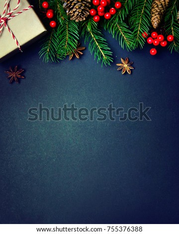 Christmas or New Year dark background, Xmas black board framed with season decorations, space for a text, view from above. Royalty-Free Stock Photo #755376388