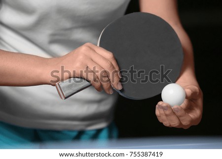 Woman playing table tennis, closeup