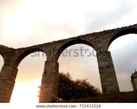 sunset picture of the historic aqueduct in the city of Vila Do Conde