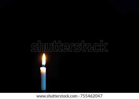 Candle light on a dark background.