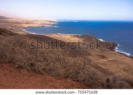 Beautiful view over beach with jagged rocks coastline on Canary Island, Tenerife.
