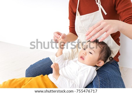 Nursery teacher care child having a cold