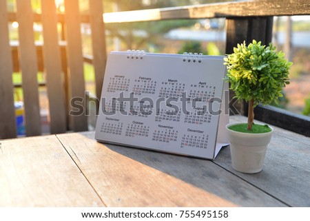 2024 Calendar desk place on the table. Desktop Calender for Planner to plan agenda, timetable, appointment, organization, management each date, month, and year on wooden office table. Calendar Concept