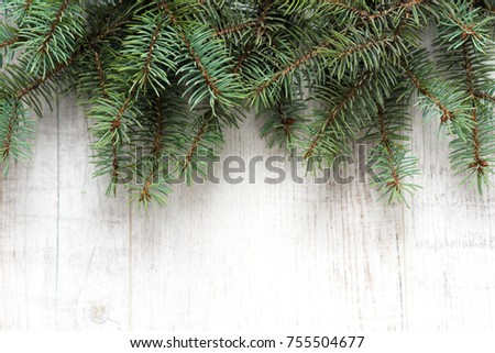 Christmas background. Christmas decorations lie on old boards. Fir branches. Handmade decorations. Light boards.
