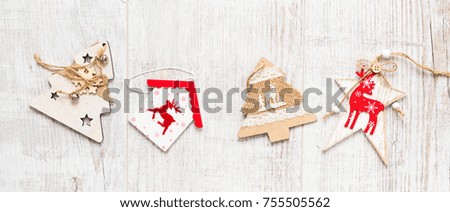 Christmas background. Christmas decorations lie on old boards. Fir branches. Handmade decorations. Light boards. Size Letter box.