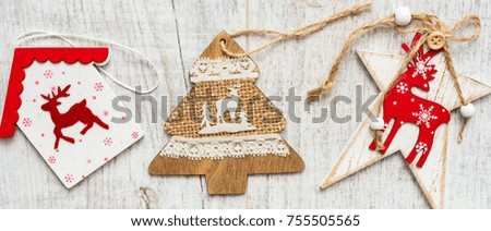 Christmas background. Christmas decorations lie on old boards. Fir branches. Handmade decorations. Light boards. Size Letter box.