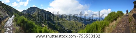Wide panoramic view of Madeira island. Pathway with woman walking. 180 degree photography