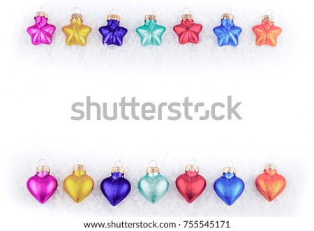 Colorful Christmas tree decorations on snow, white background and copy space