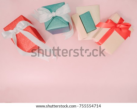 colorful from group of present box with wraping by shiny paper for celebration christmas , birthday or new year on pink pastel background