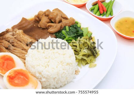Thai stewed pork leg with rice and mix vegetable on white background (Kao Kha Moo)