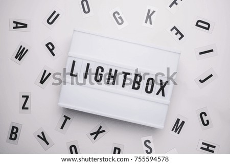 Lightbox on a table with typography letters