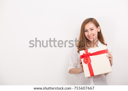 Joyful woman with gift box isolated on white background. Beauty and fashion.
