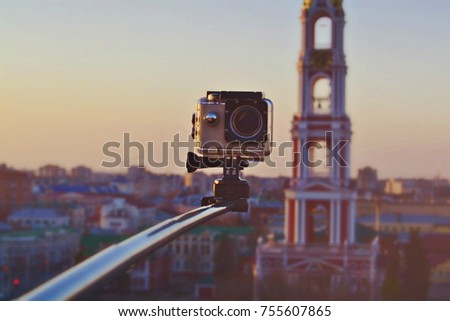 Action camera mounted on the monopod.