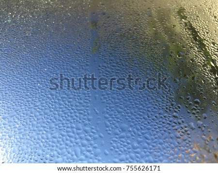 Water drops on glass window background texture
