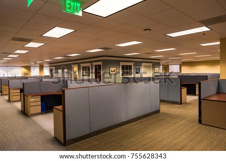An empty office space with furnished cubicles ready to be occupied. Royalty-Free Stock Photo #755628343