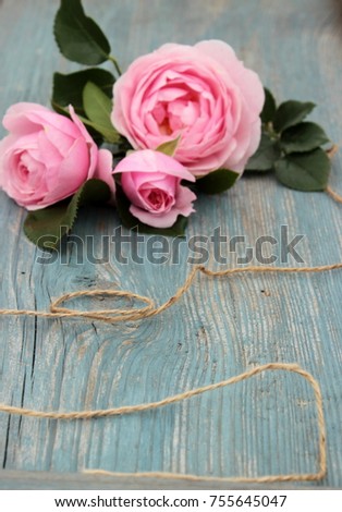 Pretty card with bunch of pink roses on vintage blue plank