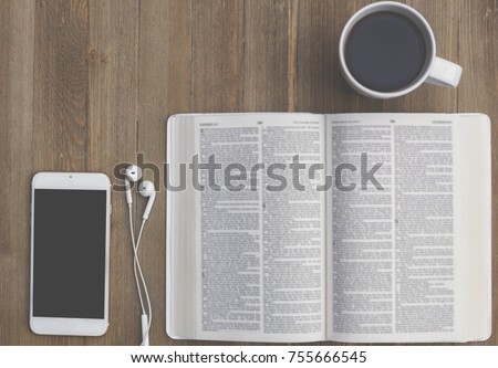 Bible Study with Smart Phone and Coffee, script blurred Royalty-Free Stock Photo #755666545