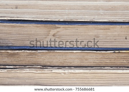 Stacked old bound and yellowed books as background picture 