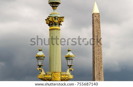 Obelisk in Place de la Concorde against cloudy sky - Paris.