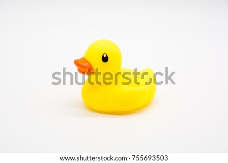 Yellow plastic toy duck isolated on a over white background