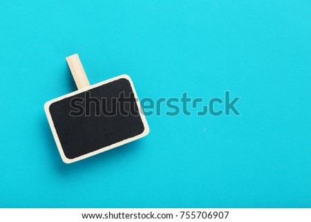 Small blackboard on the blue background