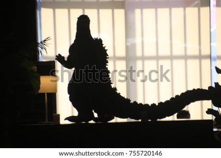 Big dinosaur silhouette.
