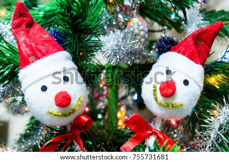 snowman on a spruce branch in the new year background