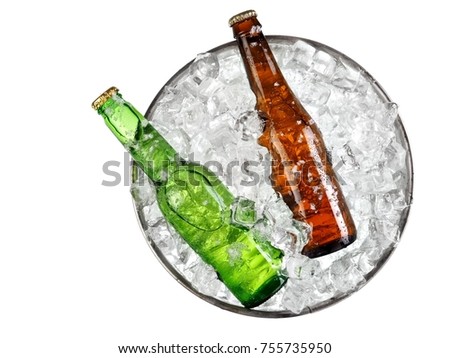 Two small beer bottles with drops in a bucket with ice, top view