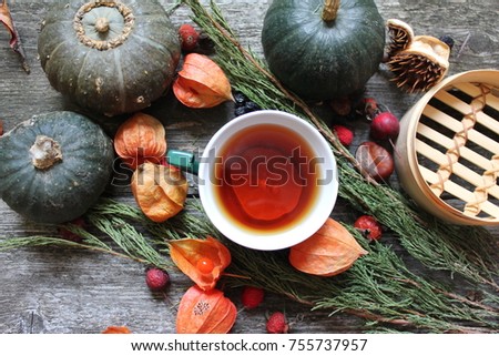 tea witj lemon and pumpkins and cape gooseberry