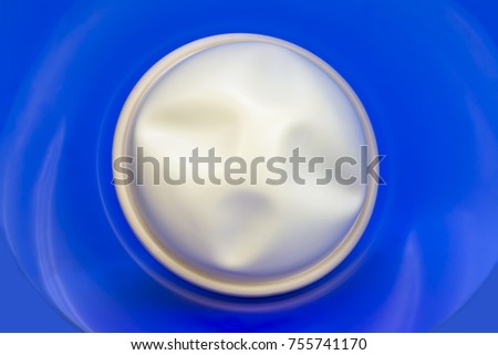 Contraceptive diaphragm on blue glass background Royalty-Free Stock Photo #755741170