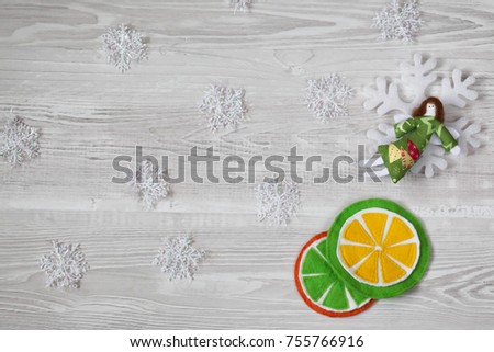Procurement for New Year or Christmas greetings. Decoration to the angel and felt circles of orange