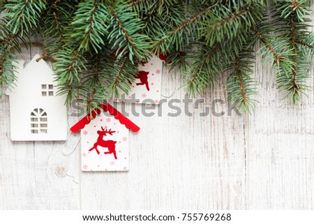 Christmas background. Christmas decorations lie on old boards. Fir branches. Handmade decorations. Light boards.