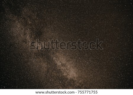 Background of gray starry night sky with the Milky Way.