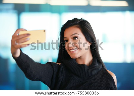 beautiful latina spanish hispanic girl taking selfie picture of herself 