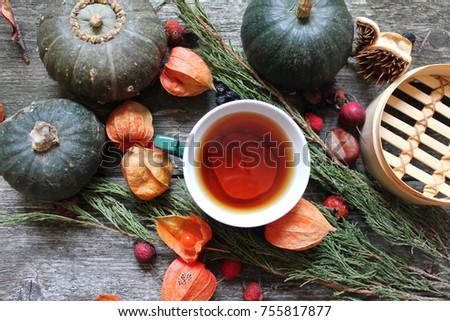 tea with lemon, pumpkin and cape gooseberry, autumn composition