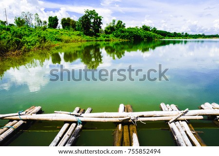 Wooden pier on big lake in Thailand