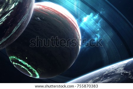 Colossus gas giant with small planets-satellites orbiting it. Elements of this image furnished by NASA