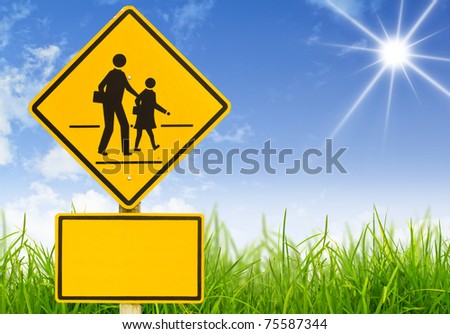 Traffic sign (School warning sign) on grass