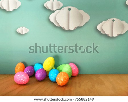 Colorful closeup image of decoration balls front of light background with white origami clouds.